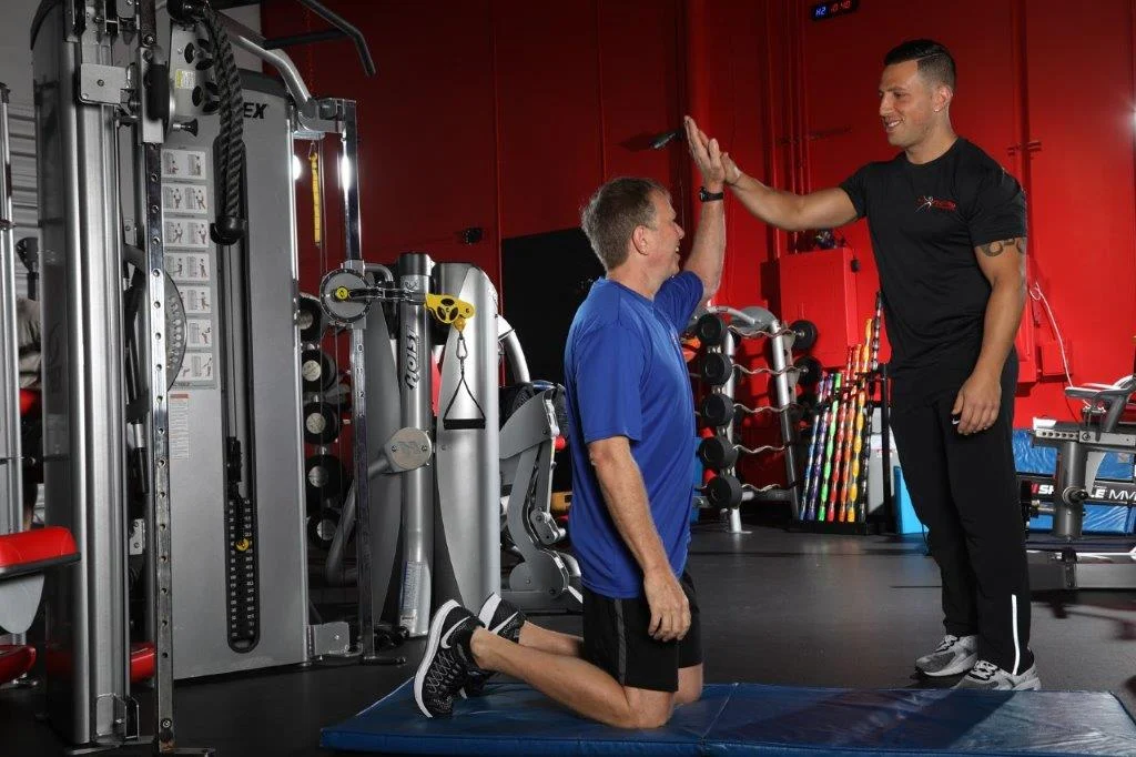 personal trainers working with client